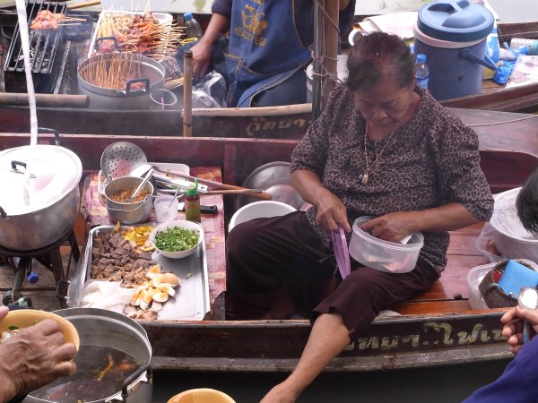 Preparing food at Tha Kha floating market